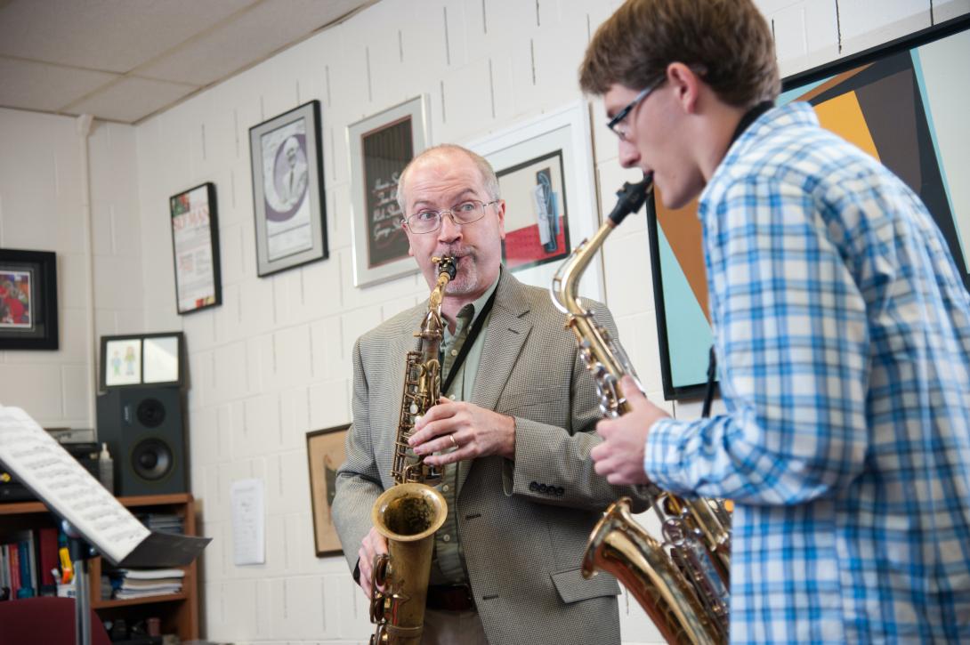 Tom Reed giving a saxaphone lesson