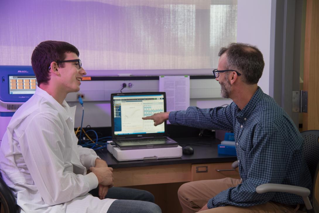 Professor Posner interacts with one of his students studying zebrafish