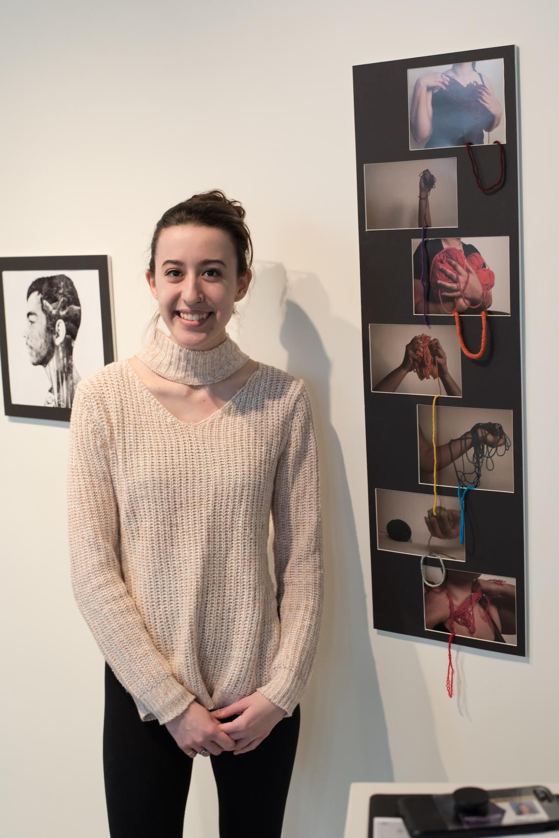 Student exhibiting her digital art in the Coburn Gallery