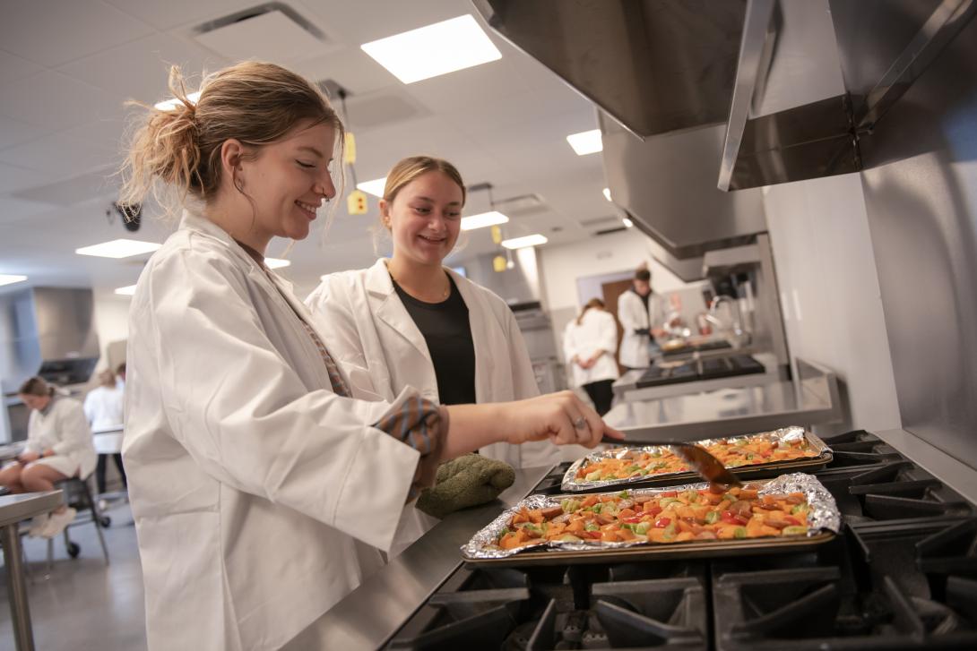 students cooking in dietetics food lab
