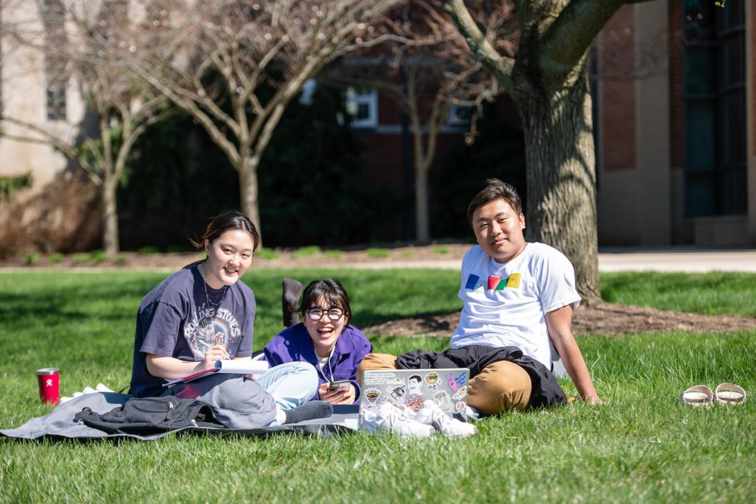 Students sitting on the Quad.