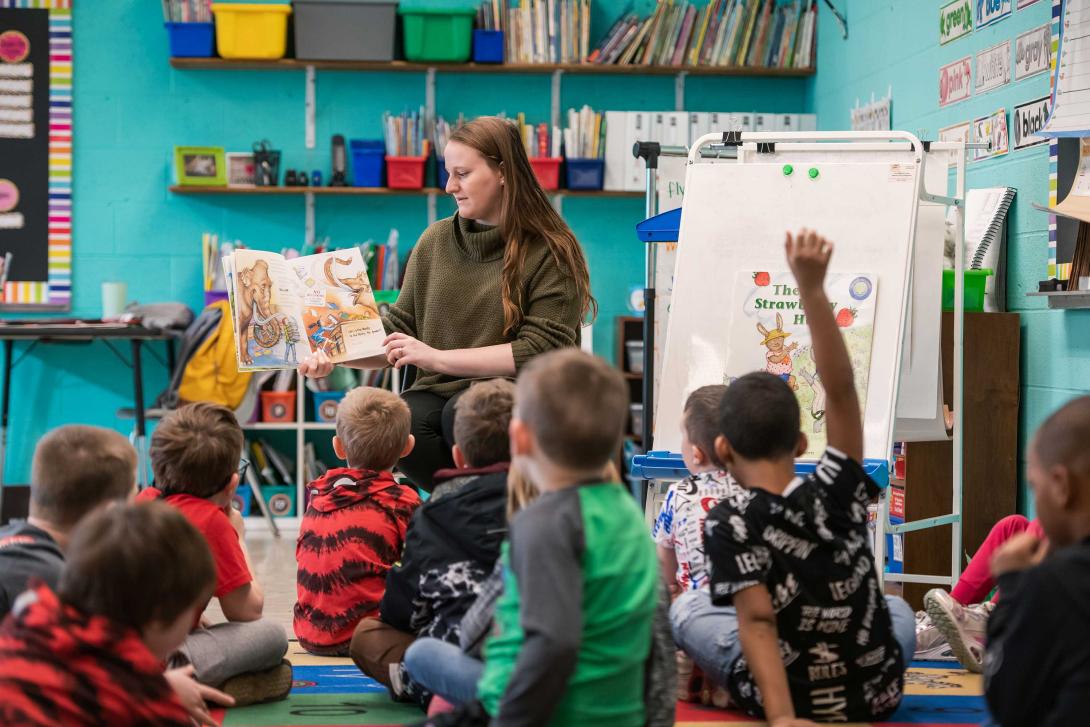 Teacher reading to students in elementary classroom