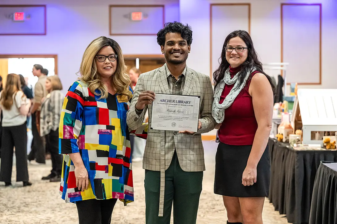 Prabesh Sunar receives the Archer Library Excellence in Undergraduate Research Award at the 2026 URCA Symposium