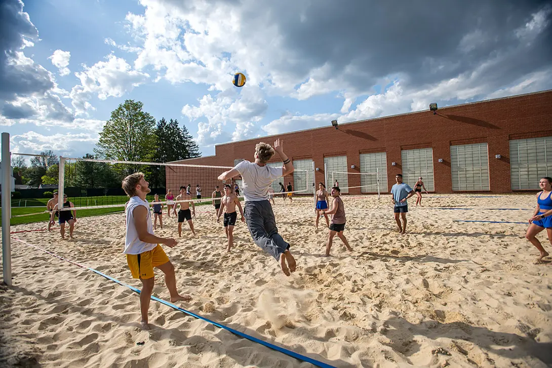 students playing beach volleyball outside the Rec Center in 2025